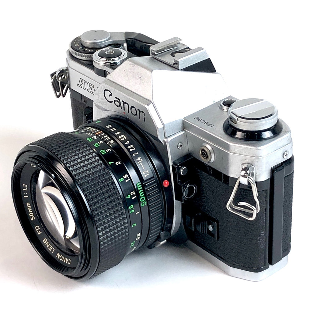 キヤノン Canon AE-1 + NEW FD 50mm F1.2 フィルム マニュアルフォーカス 一眼レフカメラ 【中古】