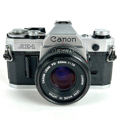 キヤノン Canon AE-1 シルバー + NEW FD 50mm F1.8 ［ジャンク品］ フィルム マニュアルフォーカス 一眼レフカメラ 【中古】
